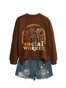 Detail of brown social worker sweatshirt with floral print and ripped denim shorts