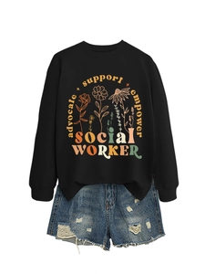Detail of social worker floral print on black sweatshirt paired with denim shorts