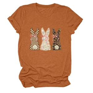 Detail of bunny prints in plaid, floral and leopard patterns on orange crew neck t-shirt