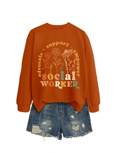 Detail of caramel floral sweatshirt with advocate support empower text and denim shorts