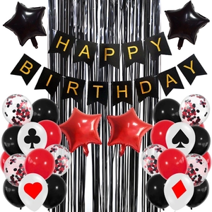 Detail of poker party kit with black and red balloons, banner and foil curtains