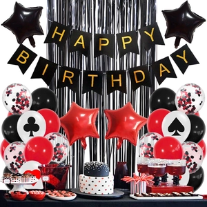 Detail of red and black poker theme party balloons with Happy Birthday banner and backdrop