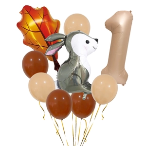 Detail of caramel number 1 balloon with cartoon rabbit and maple leaf forest theme