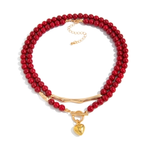 Vintage red acrylic beaded necklace with gold heart pendant and metal OT toggle clasp