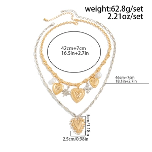 Detailed size and weight chart for layered heart and star pendant necklaces in gold and silver
