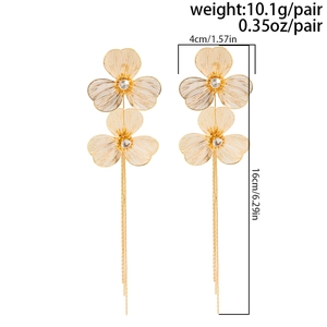 Detailed view of golden ginkgo leaf earrings with tassels and size measurements