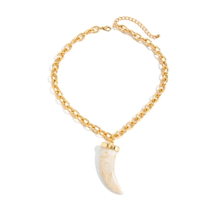 Chunky gold chain necklace featuring ivory marbled horn pendant with metallic top cap