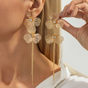 Elegant gold ginkgo petal fringe earrings with crystals shown on model for a luxury style