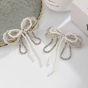 Elegant silver pearl bow necklace with rhinestone chain tassels and minimalist design