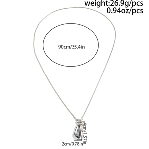 Detailed view of 90cm long chain necklace with faceted teardrop pendant and OT buckle