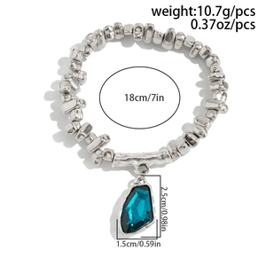 Silver bead bracelet with blue gem pendant and size details 18cm length plus 10.7g weight