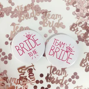 Pink and white Team Bride and Bride to Be pins for bridal shower parties