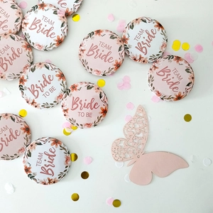 Wedding party tinplate badges with floral design and Bride To Be text for bridal shower decor