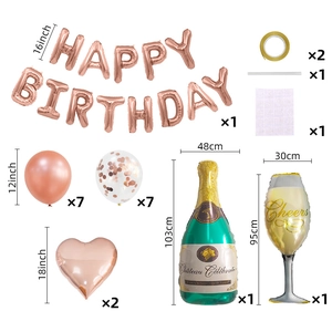 Flat lay of rose gold birthday party set with foil letters, latex balloons, and champagne bottle