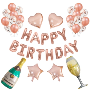 Rose gold birthday party kit with Happy Birthday balloons, champagne bottle and foil fringe
