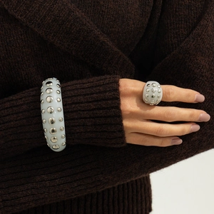 White resin chunky bracelet and ring set with silver metal studs in minimalist punk style