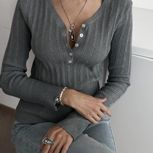 Silver jewelry set with dark grey teardrop crystals on model including necklace and ring