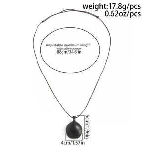 Detailed view of black matte stone heart pendant with cord measurements and specs