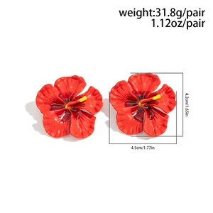 Macro detail of red hibiscus flower earrings with weight and size specifications