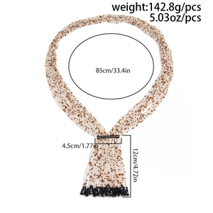 Detail view of multi-layer beaded necklace with black tassel and product dimensions