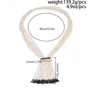 Detail view of multilayer beaded necklace with 85cm length and crystal tassel dimensions