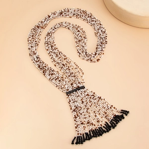 Bohemian beaded long Y-necklace with multi-layered beads and black tassel fringe design
