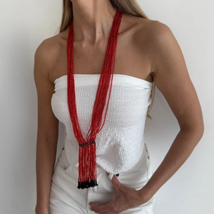 Bohemian multi-layer red seed bead long necklace with black tassel pendant on model