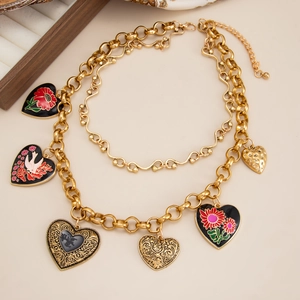 Vintage gold layered necklace with six colorful enamel and engraved heart pendants