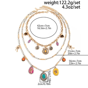 Detailed view of layered bohemian necklaces with colorful gemstones and sun pendants