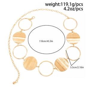 Detail of gold metal body chain with large open rings and textured solid discs