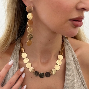 Champagne gold brushed metal jewelry set with leaf-textured disc necklace and earrings