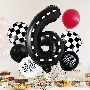 Racing theme party set with number 6 balloon, checkered flags and birthday dessert table