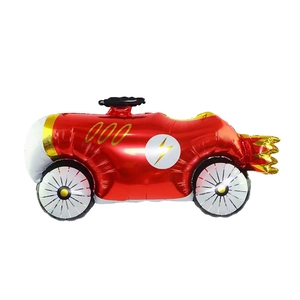 Racing car shaped foil balloon in bright red with golden fire details for party decor