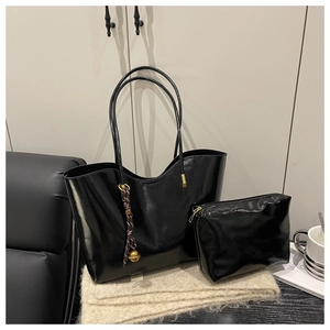 Large black oil wax leather tote bag and pouch set with decorative tassel and bell