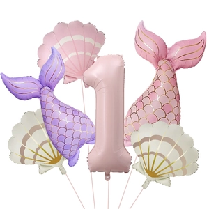 Detail of 1st birthday mermaid balloon set including pink number one and shell shapes