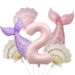 Detail of 2nd birthday mermaid balloon set with shell and fishtail foil decorations