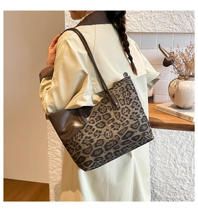 Detail of leopard print tote bag showing premium suede texture and sturdy shoulder strap