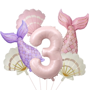 Detail of mermaid party balloon set including shell shapes and pink number three balloon