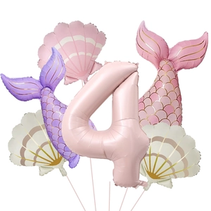 Detail set of matte mermaid balloons including a pink number 4, shells, and fish tails