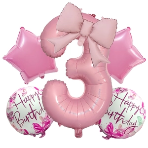 Detail of pink number 3 foil balloon set with bow and star shapes for birthday decor