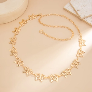 Close-up of golden butterfly link belt with adjustable chain and lobster clasp