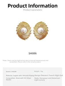 Detailed view of 18K gold plated brass ear studs with large pearls and 925 silver needles