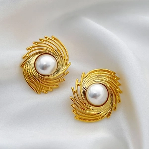French vintage style earrings with large white pearls and gold-plated spiral sunburst frames