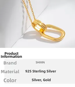 Macro detail of interlocking double rings on 925 sterling silver golden necklace