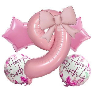 Close-up of pink number 9 foil balloon set with star and happy birthday patterns