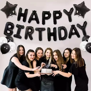 Black Happy Birthday foil letter balloons with star accents and latex party decorations