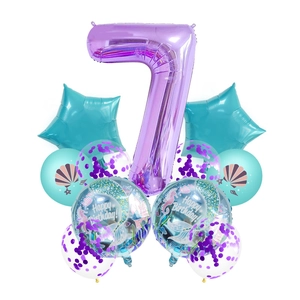 Mermaid birthday set featuring a 40-inch purple number 7 foil balloon and ocean shells