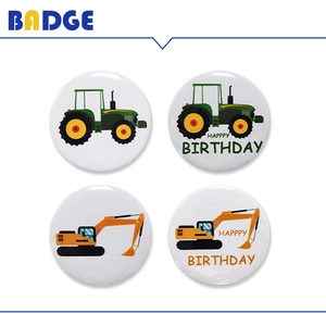 Detailed view of four construction vehicle badges including tractor and excavator designs