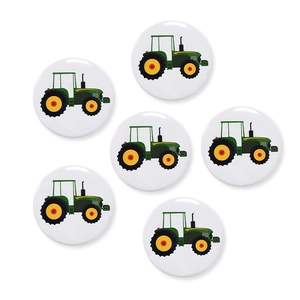 Set of six round tinplate badges with green tractor illustrations for birthday parties
