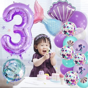 Close-up of mermaid 3rd birthday balloon set with purple shell and gradient tail